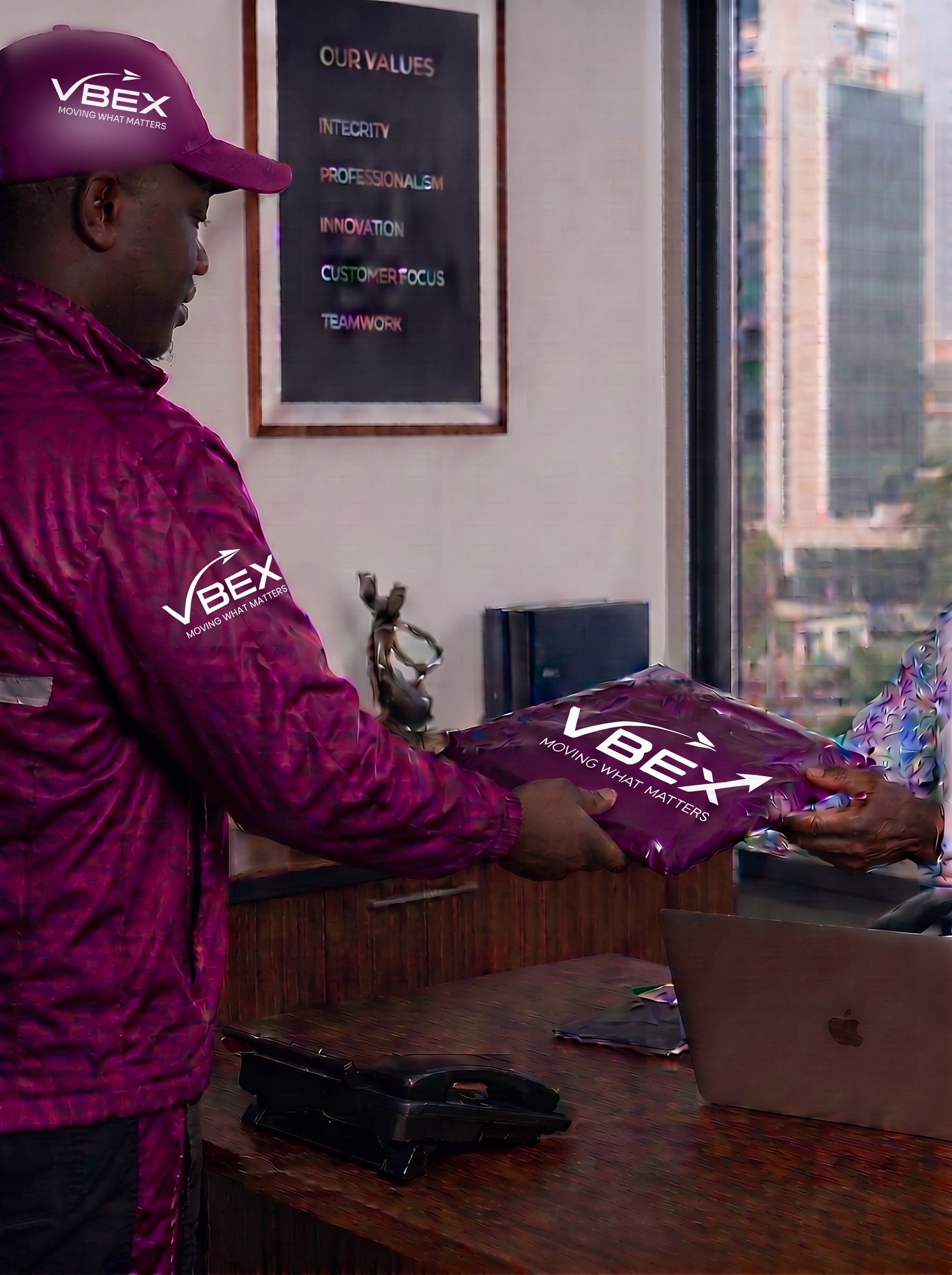 VBEX courier handing over a crimson package inside a corporate office